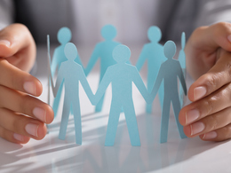 Paper cutout people in a circle