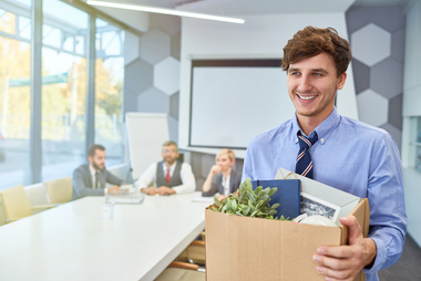 Terminated employee carrying box of personal belongings
