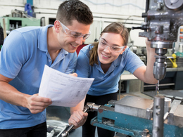 Two people working in skilled trade shop with equipment