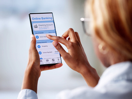 Woman tapping on phone looking at online banking app